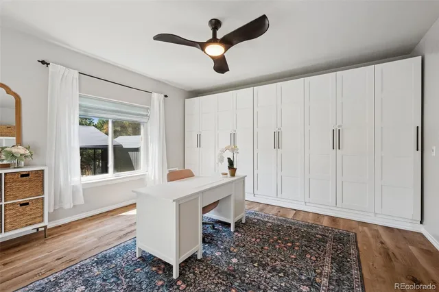 a room with window and ceiling fan