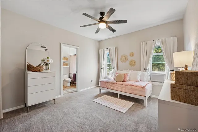 a living room with furniture and white walls