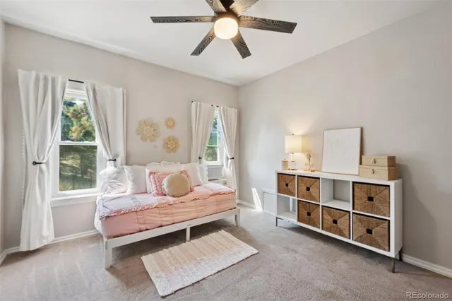 a bedroom with furniture and window