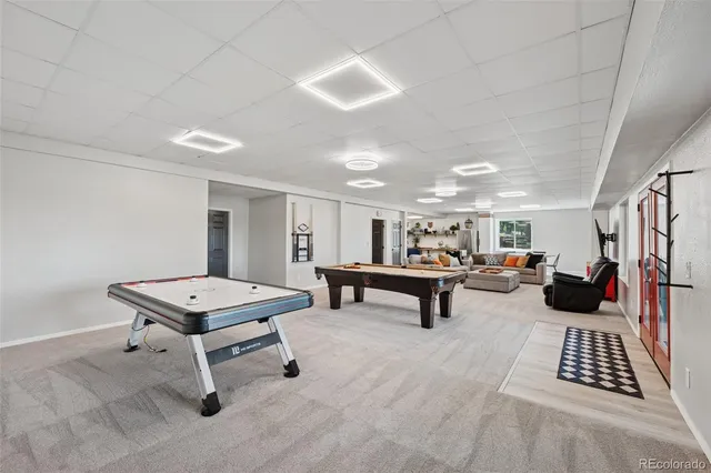 a room with furniture a table and a rug