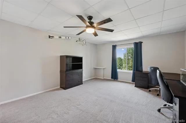 a view of workspace with furniture and windows