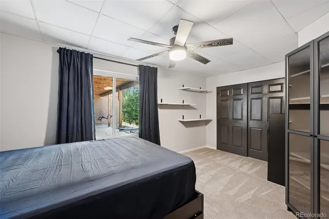 a room with a bed and a large mirror