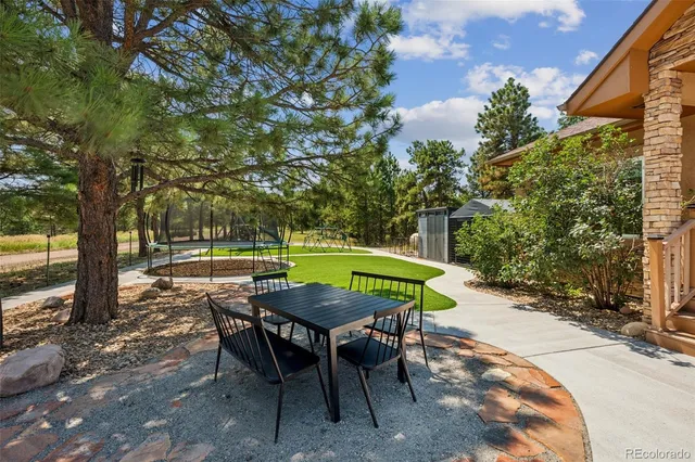 a view of a table and chairs in patio