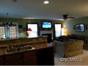 182 Pamlico Road Fletcher, NC 28732 - Photo 3 of 11 a living room with furniture and a flat screen tv
