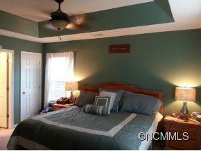 182 Pamlico Road Fletcher, NC 28732 - Photo 6 of 11 a bedroom with a bed and window