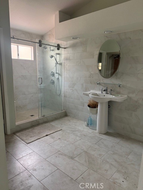 2452 Paseo Circulo Tustin, CA 92782 - Photo 2 of 6 a bathroom with a sink toilet and shower