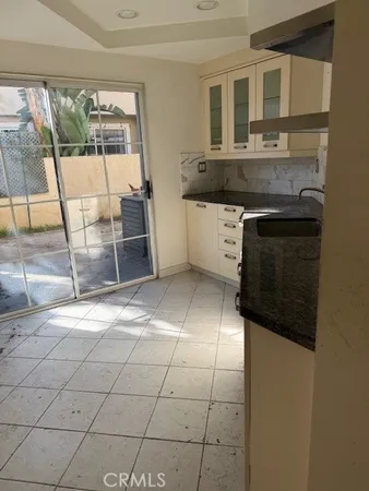 a kitchen with stainless steel appliances a stove a sink and a refrigerator