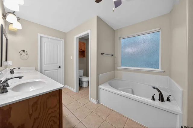 a bathroom with a bathtub and a sink