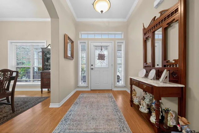a very nice looking room with wooden floor and a window