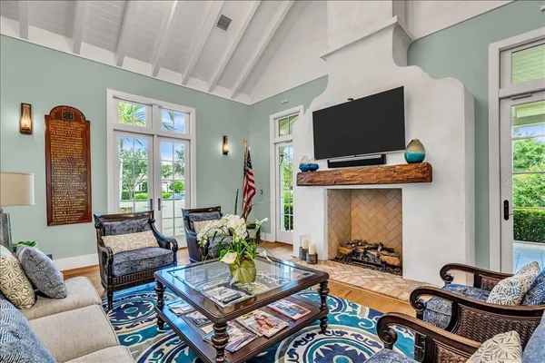 a living room with patio furniture