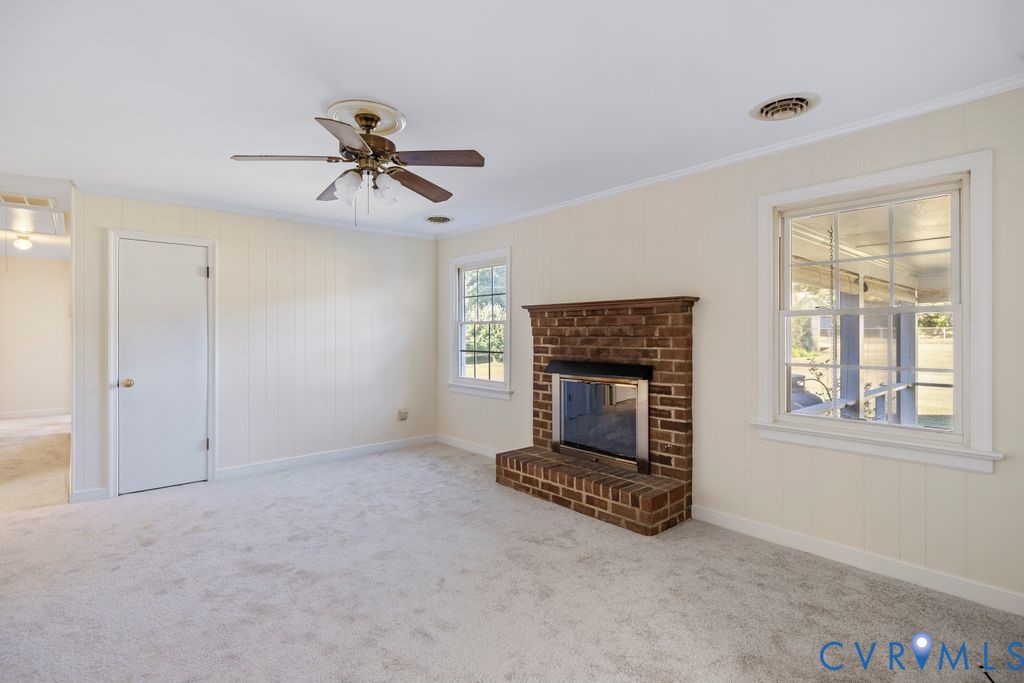 11210 Celtic Road Chesterfield, VA 23838 - Photo 12 of 39 a living room with furniture and a fireplace