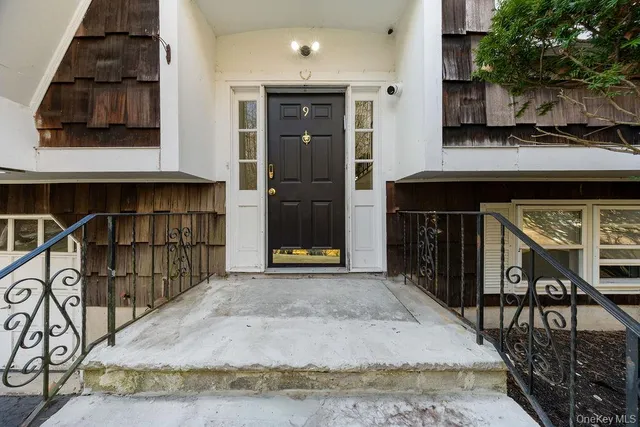 a view of a livingroom with furniture and a window