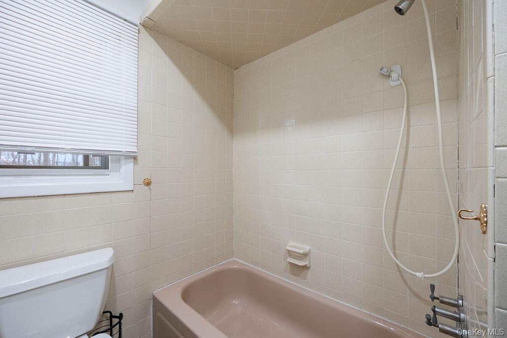 9 New Ackertown Road Monsey, NY 10952 - Photo 23 of 37 a bathroom with a sink a toilet and shower