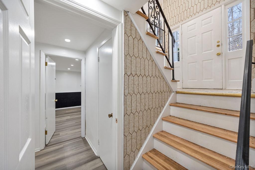 9 New Ackertown Road Monsey, NY 10952 - Photo 24 of 37 a view of a hallway with wooden floor and entryway
