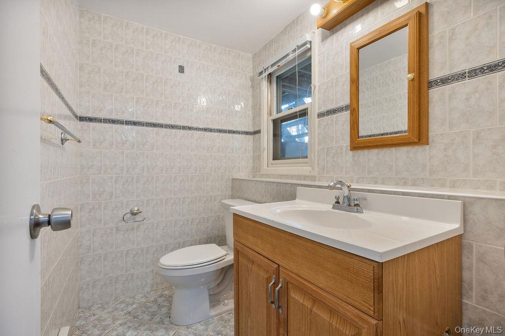 9 New Ackertown Road Monsey, NY 10952 - Photo 27 of 37 a bathroom with a sink a toilet and shower