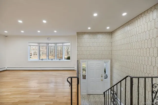 a view of entryway with wooden floor