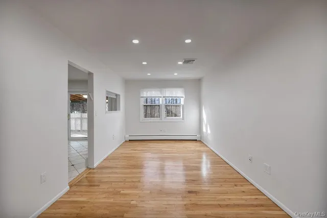 a view of an empty room and window