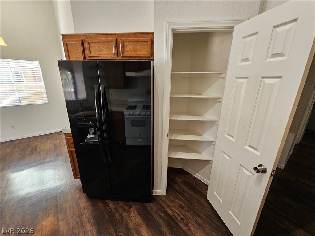 2817 Albemarle Way Henderson, NV 89014 - Photo 5 of 25 A well-equipped kitchen space features rich wood flooring and a convenient pantry for ample storage.