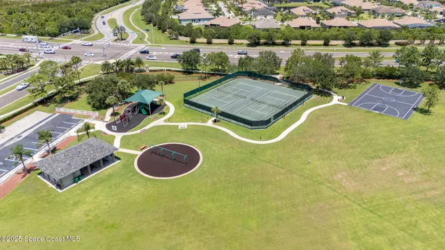 a view of a back yard from a balcony