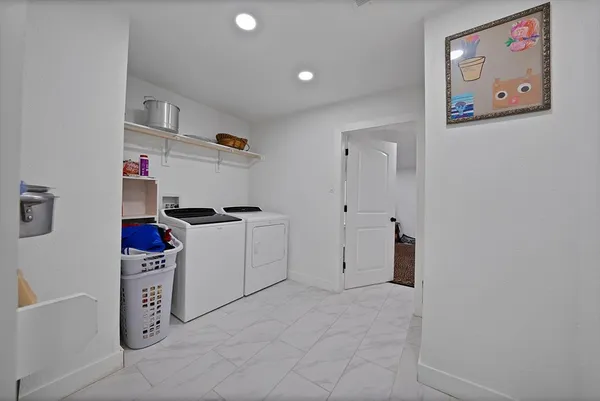 a kitchen with a refrigerator and cabinets