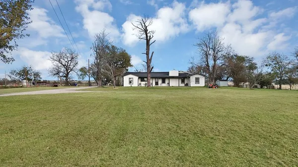 a view of a field with tree s