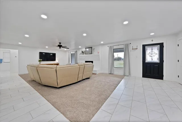 a kitchen with stainless steel appliances granite countertop a sink and dishwasher a stove top oven with white cabinets