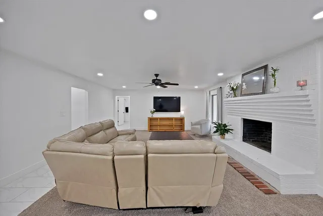 a kitchen with refrigerator and cabinets