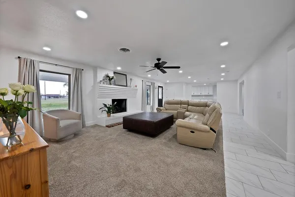 a living room with furniture and a fireplace