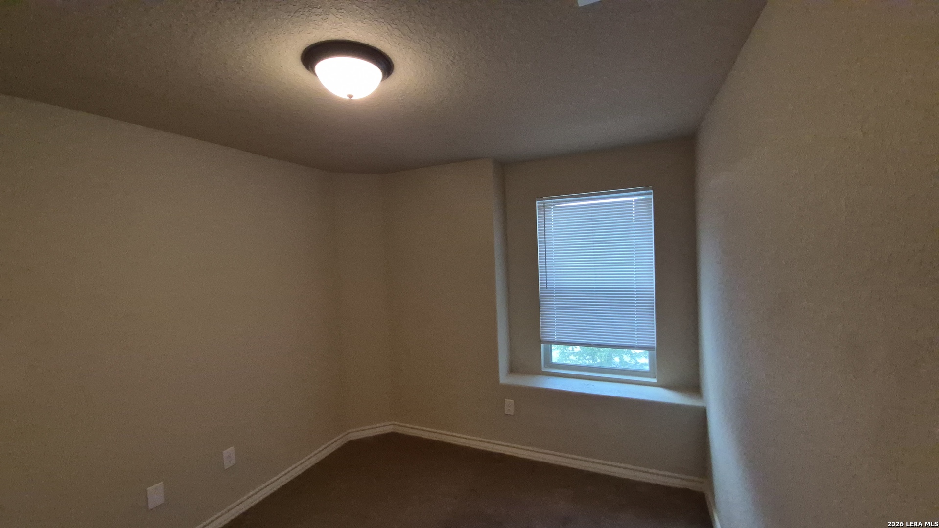 6414 Luglio Lane, Unit 101 San Antonio, TX 78233 - Photo 18 of 23 an empty room with a window