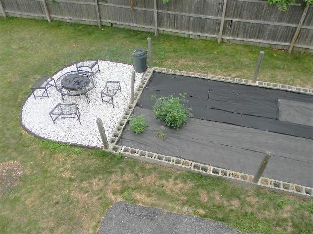 70 Colonial Road Westbrook, ME 04092 - Photo 30 of 35 Fire pit and raised beds on right...