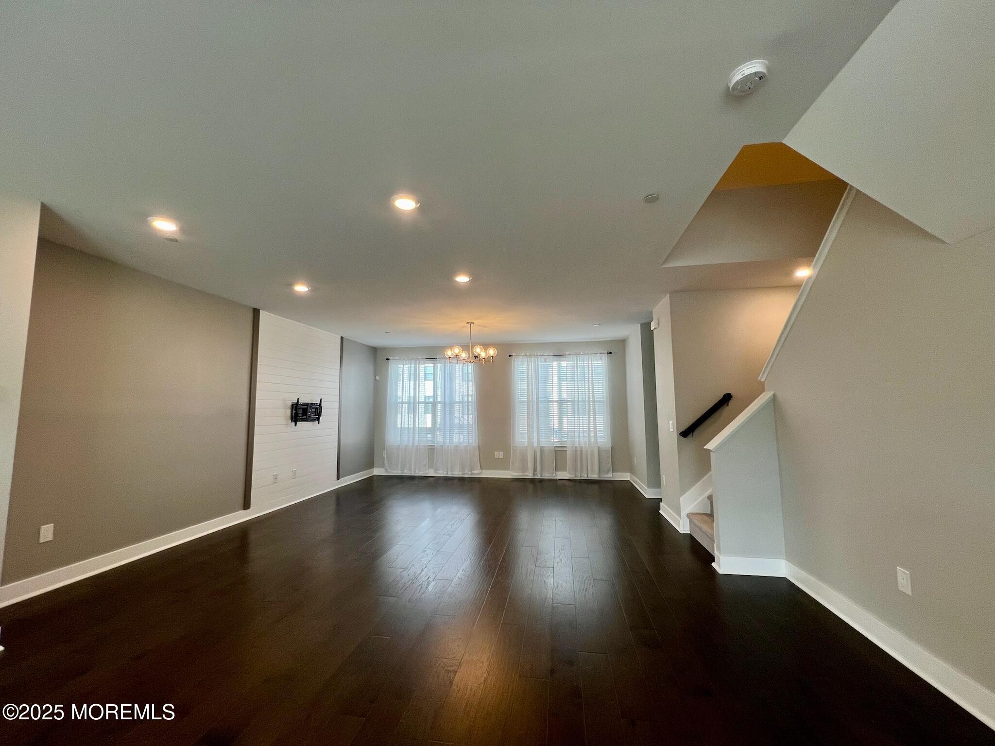 32 Mariveles Way Tinton Falls, NJ 07724 - Photo 12 of 28 an empty room with wooden floor and windows