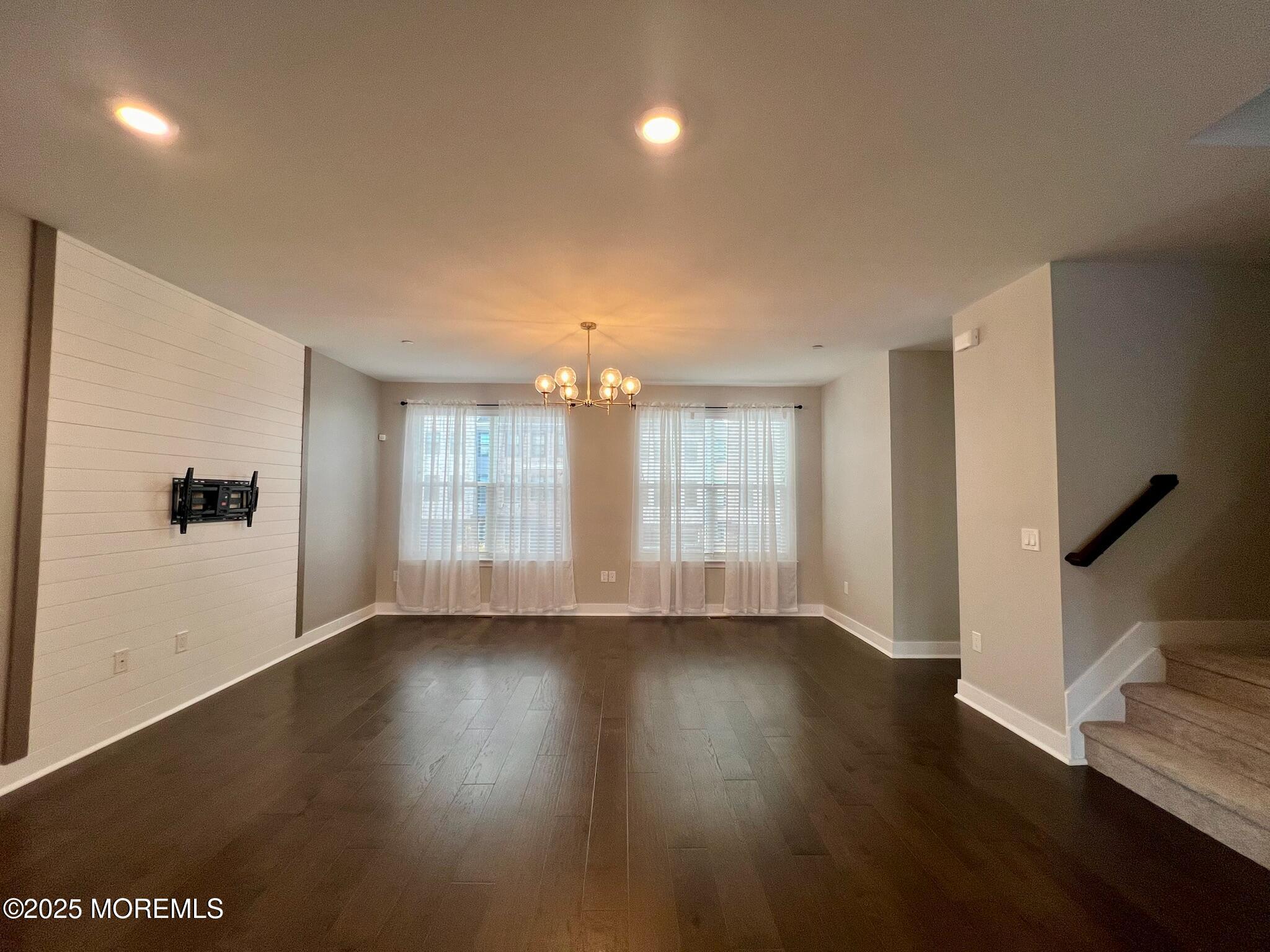 32 Mariveles Way Tinton Falls, NJ 07724 - Photo 13 of 28 a view of an empty room with wooden floor and a window