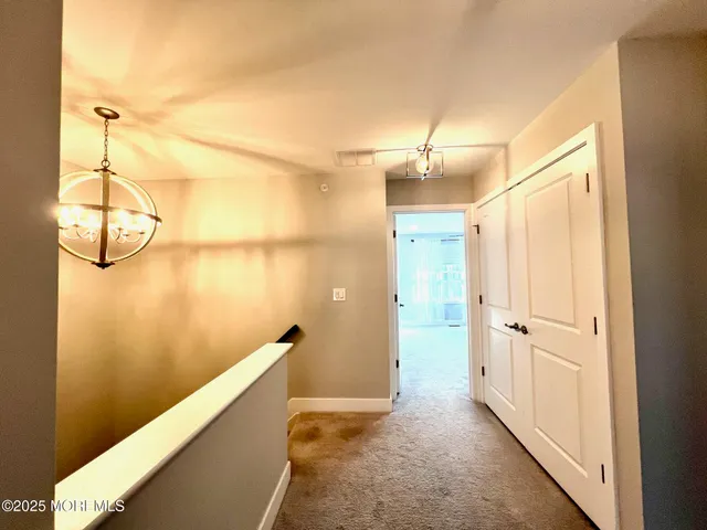 a view of a bathroom with a shower and a sink