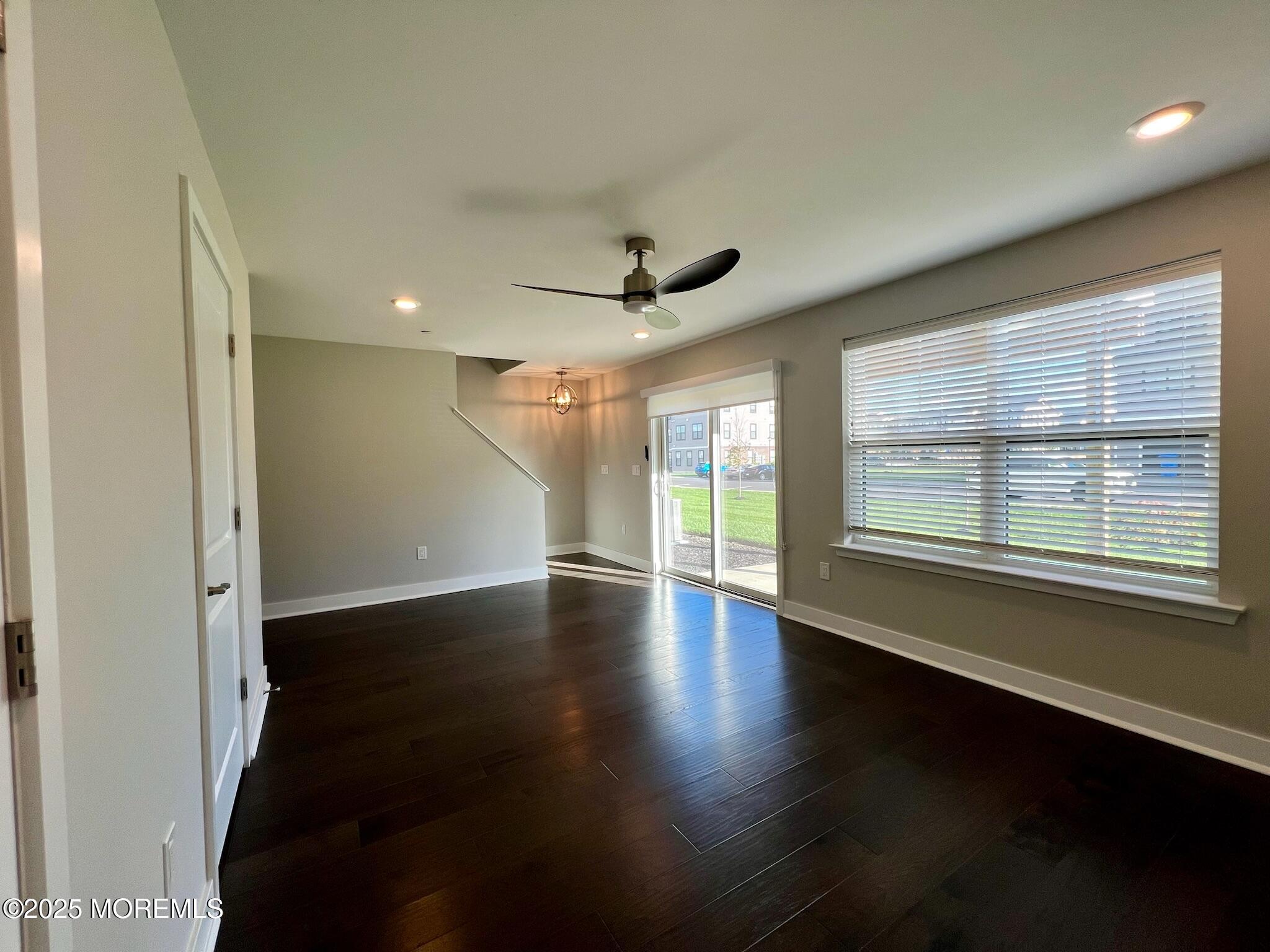 32 Mariveles Way Tinton Falls, NJ 07724 - Photo 26 of 28 an empty room with wooden floor and windows
