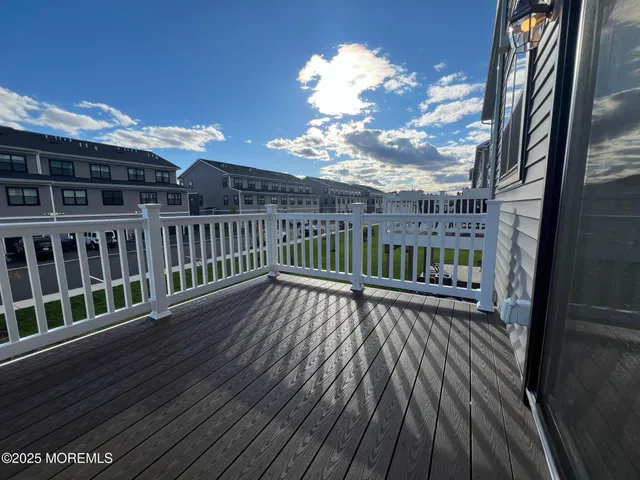 a view of balcony with wooden floor