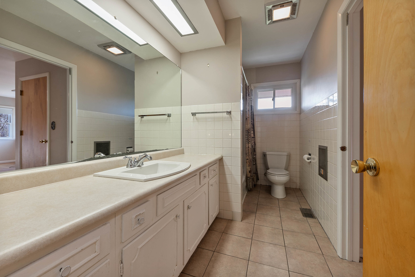 28W171 Garys Mill Road Winfield, IL 60190 - Photo 16 of 47 a spacious bathroom with a granite countertop sink mirror and a toilet