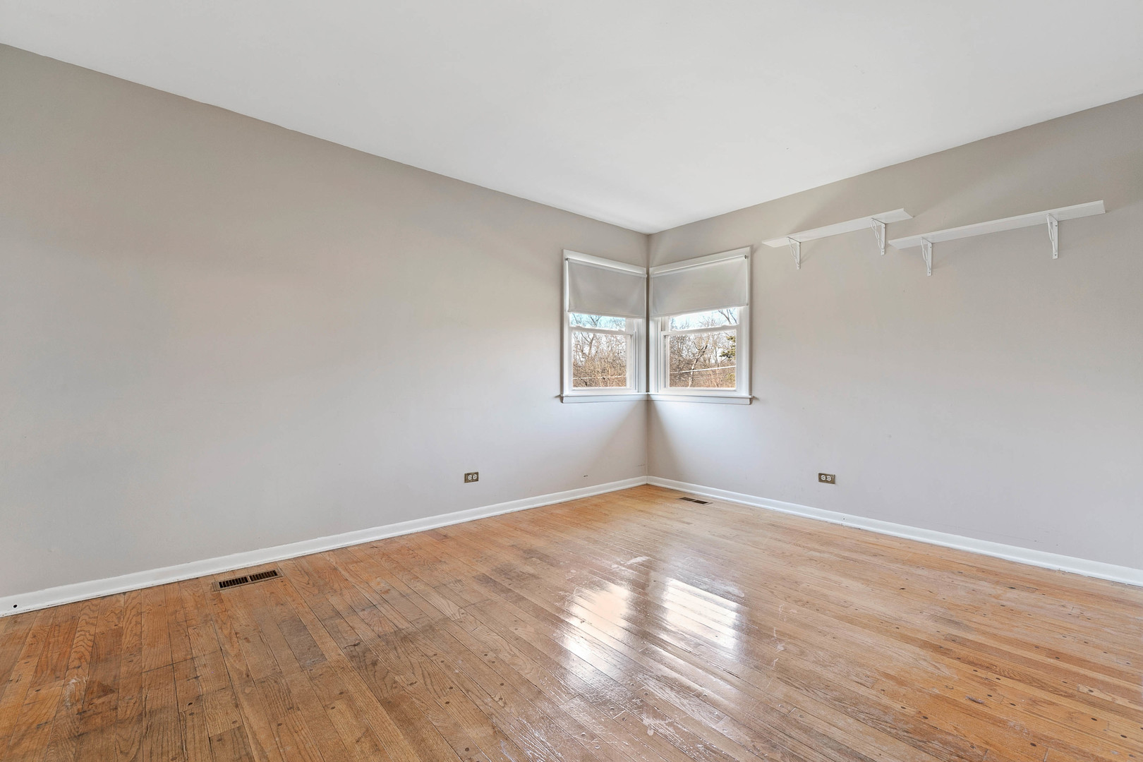 28W171 Garys Mill Road Winfield, IL 60190 - Photo 17 of 47 wooden floor in an empty room with a window
