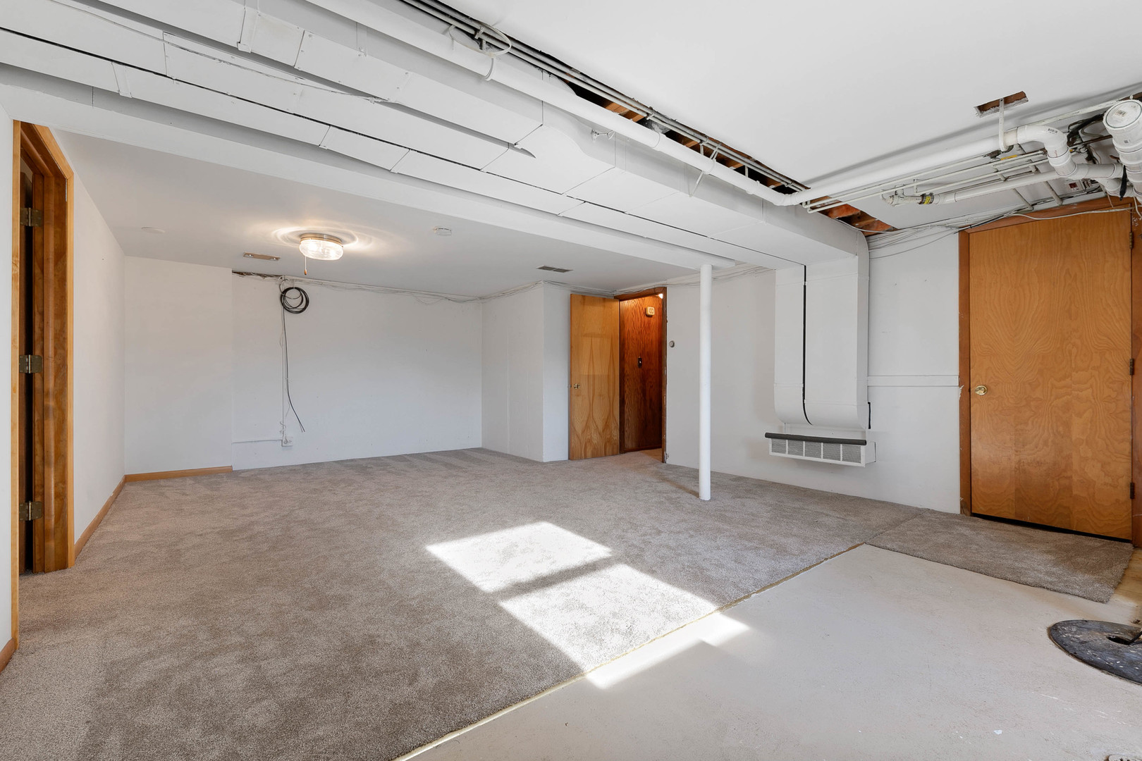 28W171 Garys Mill Road Winfield, IL 60190 - Photo 20 of 47 a view of a big room with wooden cabinet and windows
