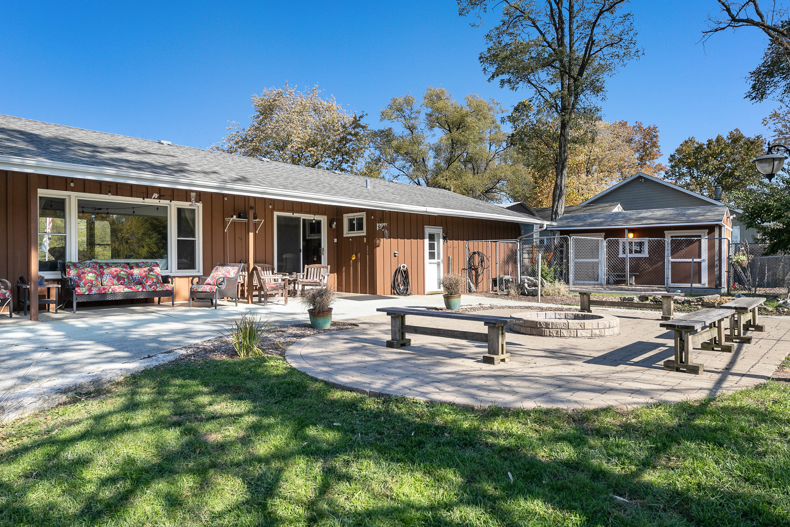 28W171 Garys Mill Road Winfield, IL 60190 - Photo 25 of 47 a view of a house with swimming pool and sitting area