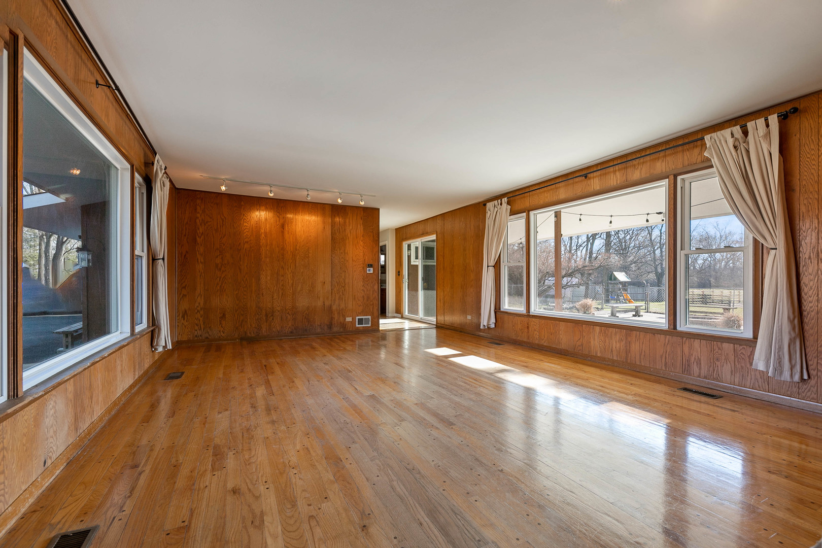 28W171 Garys Mill Road Winfield, IL 60190 - Photo 5 of 47 a view of empty room with wooden floor and fan