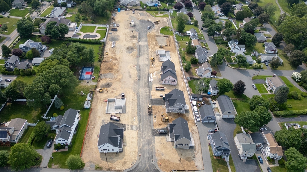 62 High Street, Unit LOT 1 Stoneham, MA 02180 - Photo 1 of 22 an aerial view of residential houses with outdoor space