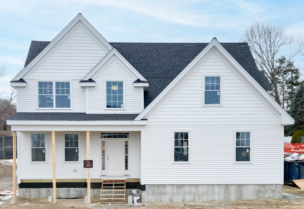 62 High Street, Unit LOT 1 Stoneham, MA 02180 - Photo 2 of 22 a view of a white house with large windows