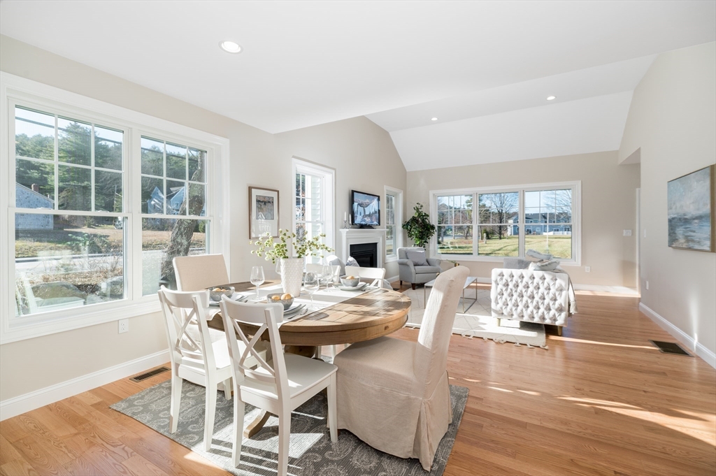 62 High Street, Unit LOT 1 Stoneham, MA 02180 - Photo 7 of 22 a view of a dining room with furniture wooden floor and a rug