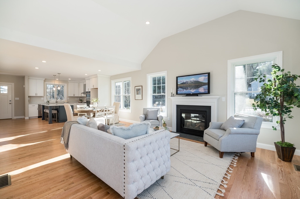 62 High Street, Unit LOT 1 Stoneham, MA 02180 - Photo 10 of 22 a living room with furniture and a fireplace