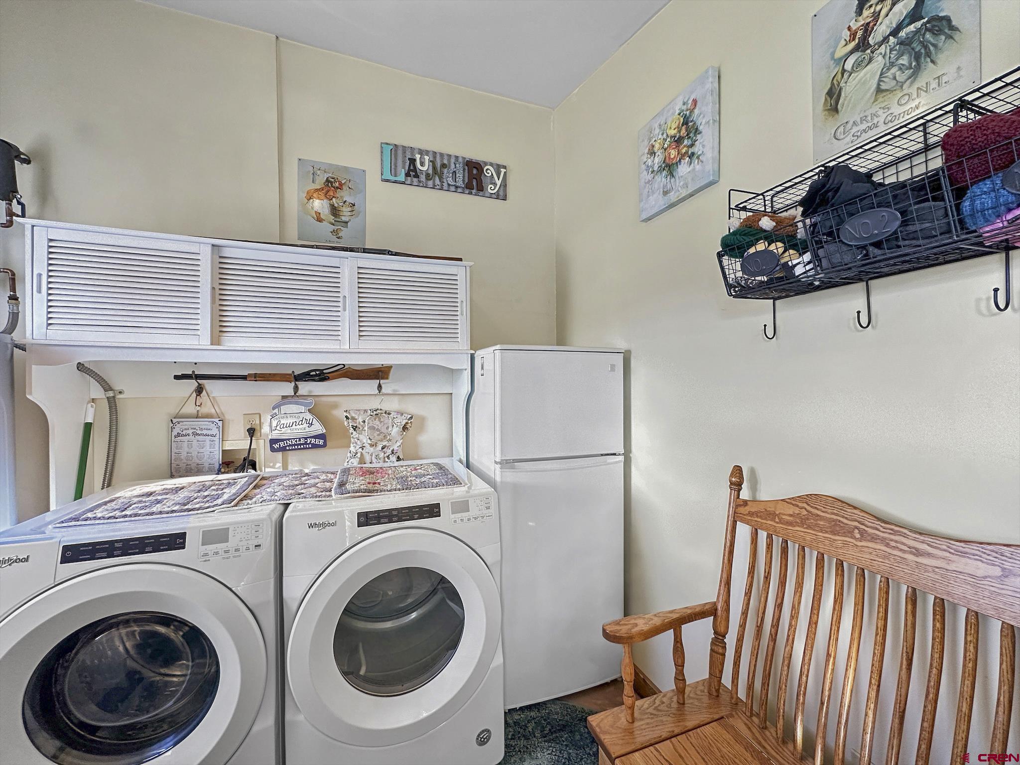 36024 Fruitland Mesa Road Crawford, CO 81415 - Photo 21 of 37 a utility room with dryer and washer