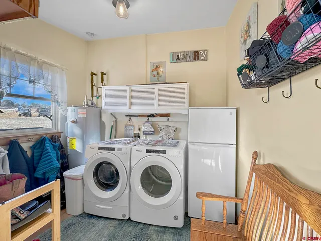 a bedroom with a bed and a chair