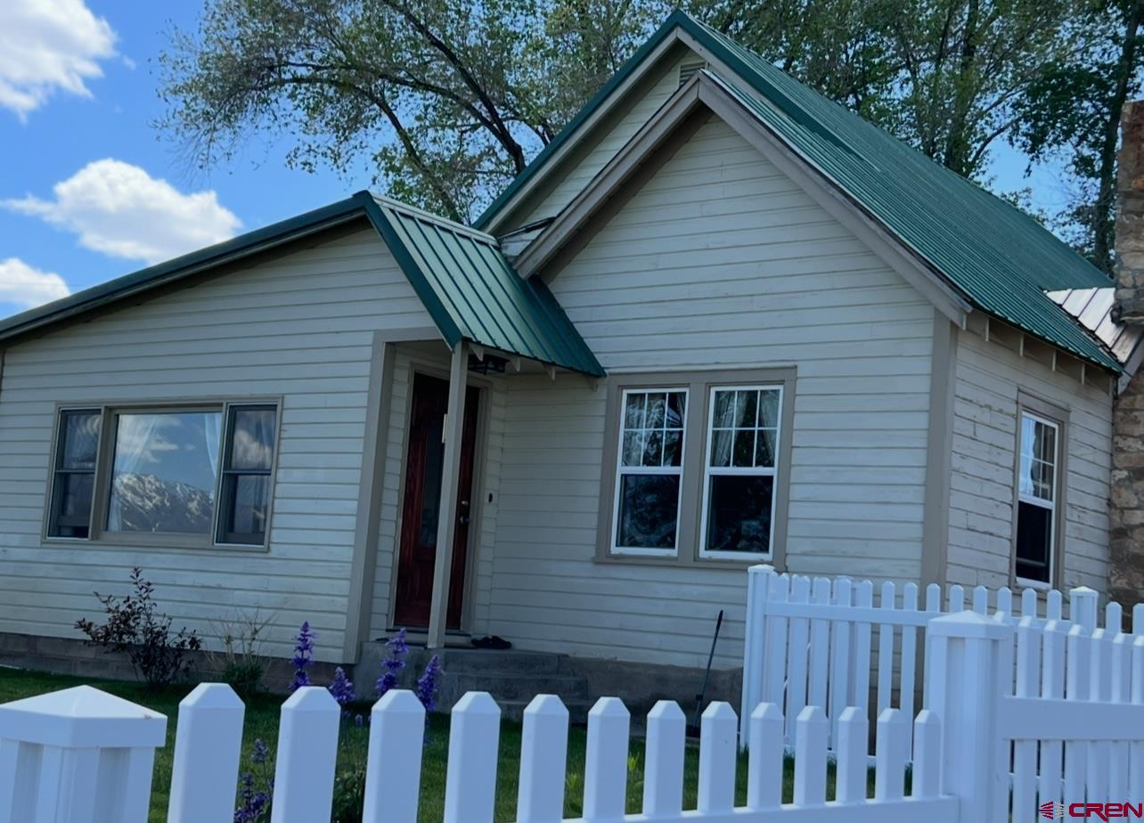 36024 Fruitland Mesa Road Crawford, CO 81415 - Photo 36 of 37 a front view of a house with a garden