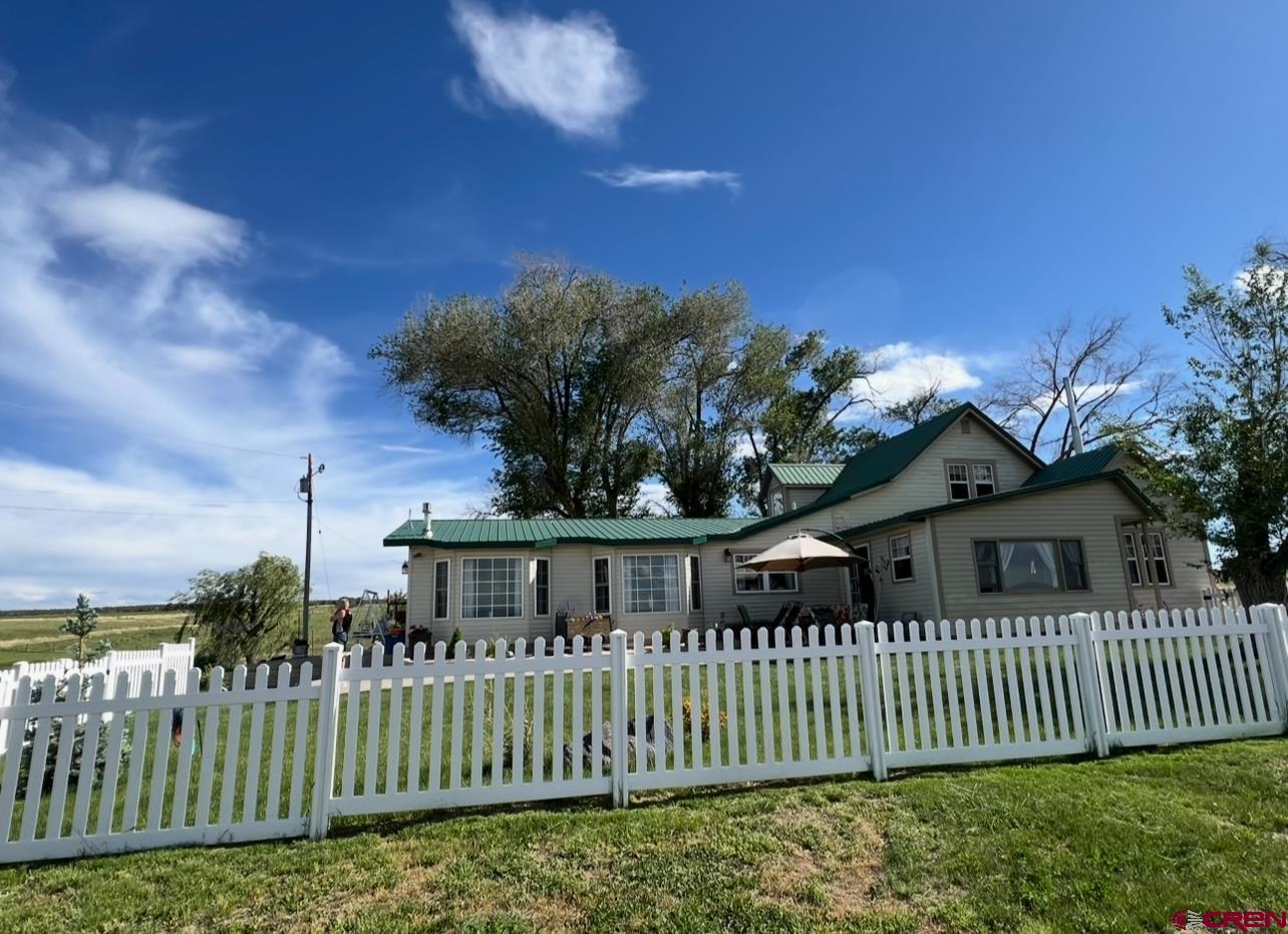 36024 Fruitland Mesa Road Crawford, CO 81415 - Photo 4 of 37 a view of a house with a small yard
