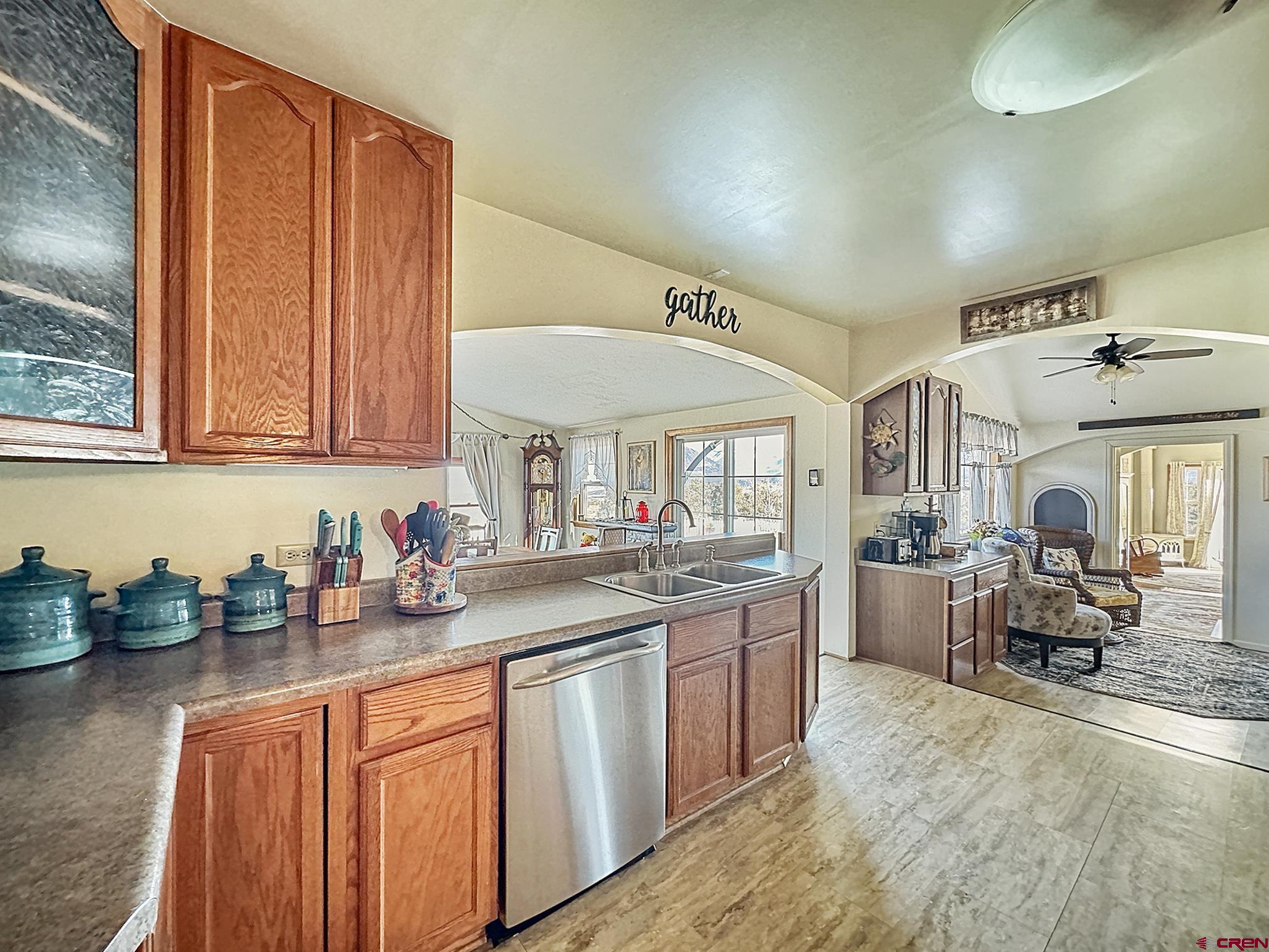 36024 Fruitland Mesa Road Crawford, CO 81415 - Photo 9 of 37 a kitchen with a sink stove and cabinets