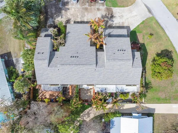 an aerial view of a house with outdoor swimming pool